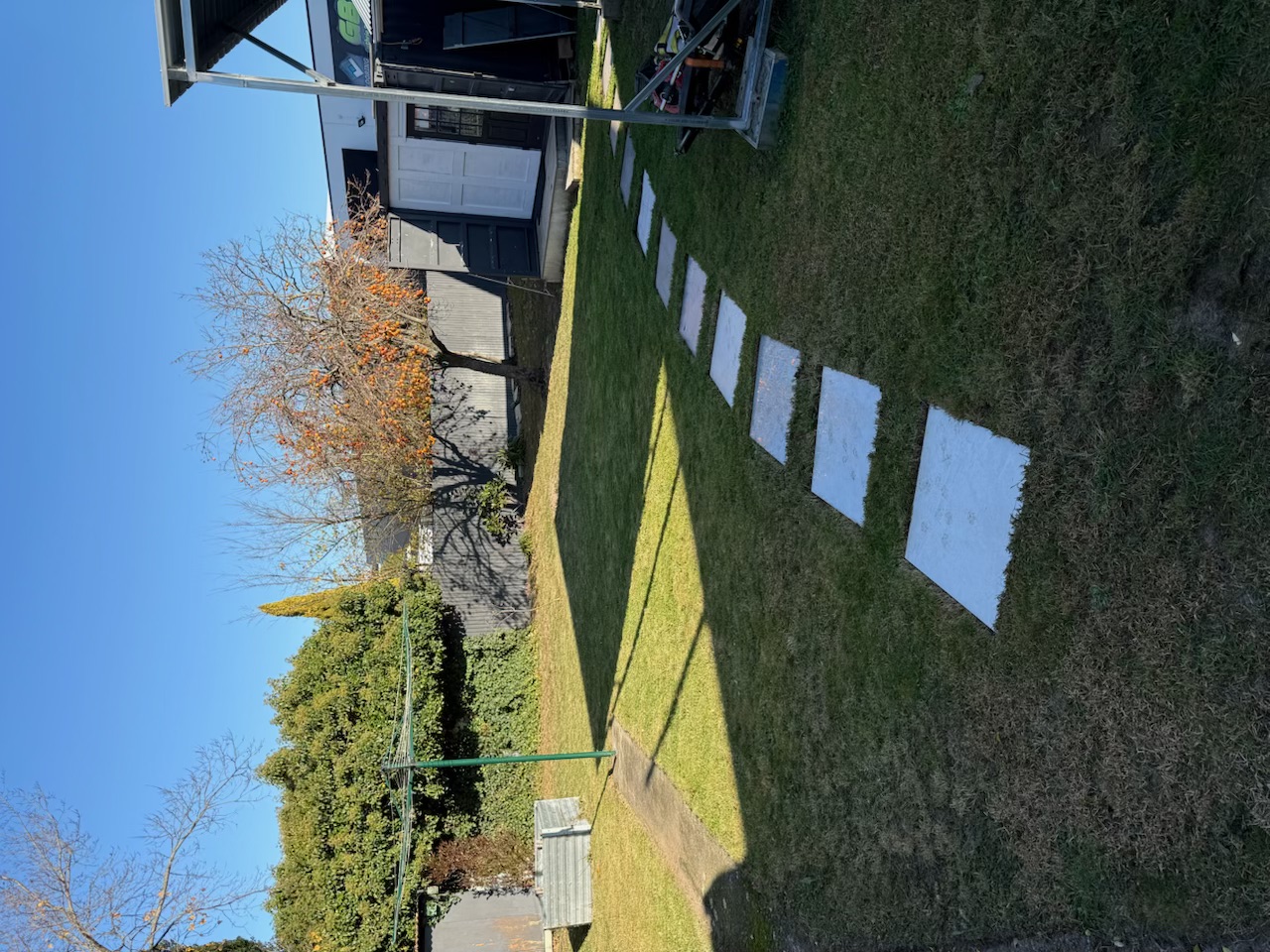 Same back lawn mowed, edges done, pavers cleared
